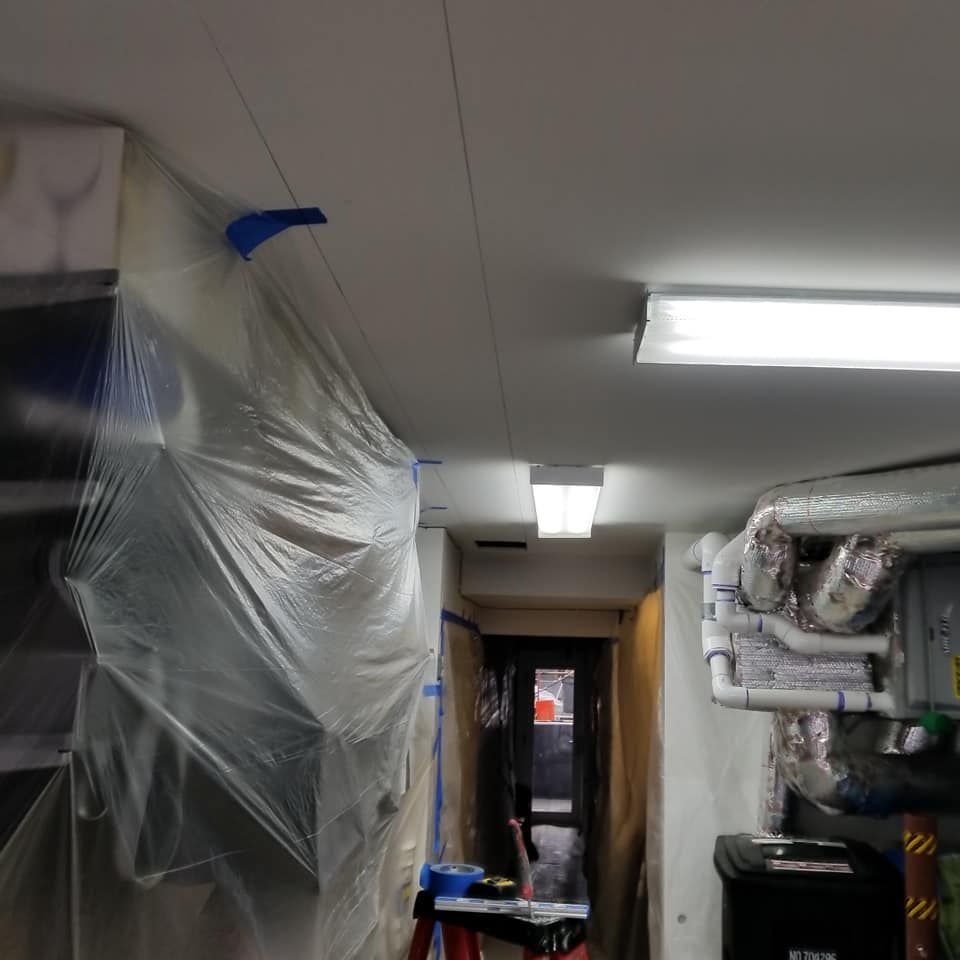 A room with a plastic cover on the ceiling