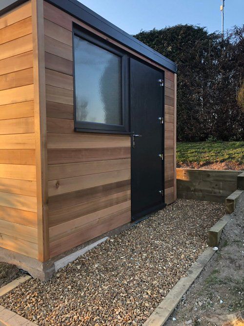 contemporary shed with black door