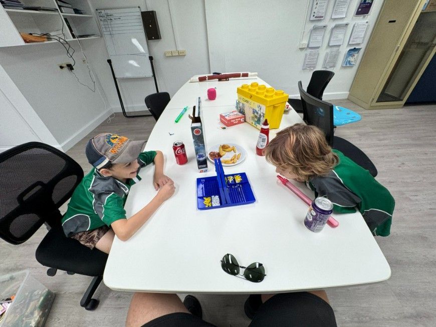 A Group Of People Are Holding A Wheelchair Icon — Specialist Support Solutions Pty Ltd in Rockhampton City, QLD