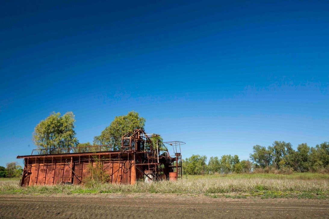 An Old Rusty Building is Sitting in the Middle of a Field — Specialist Support Solutions in Emerald, QLD