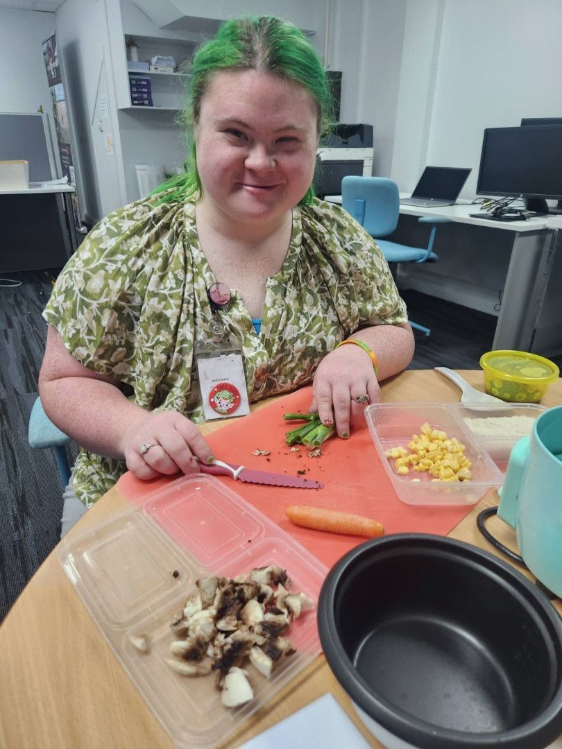 Lady chopping vegetables NDIS — Specialist Support Solutions in Rockhampton City, QLD