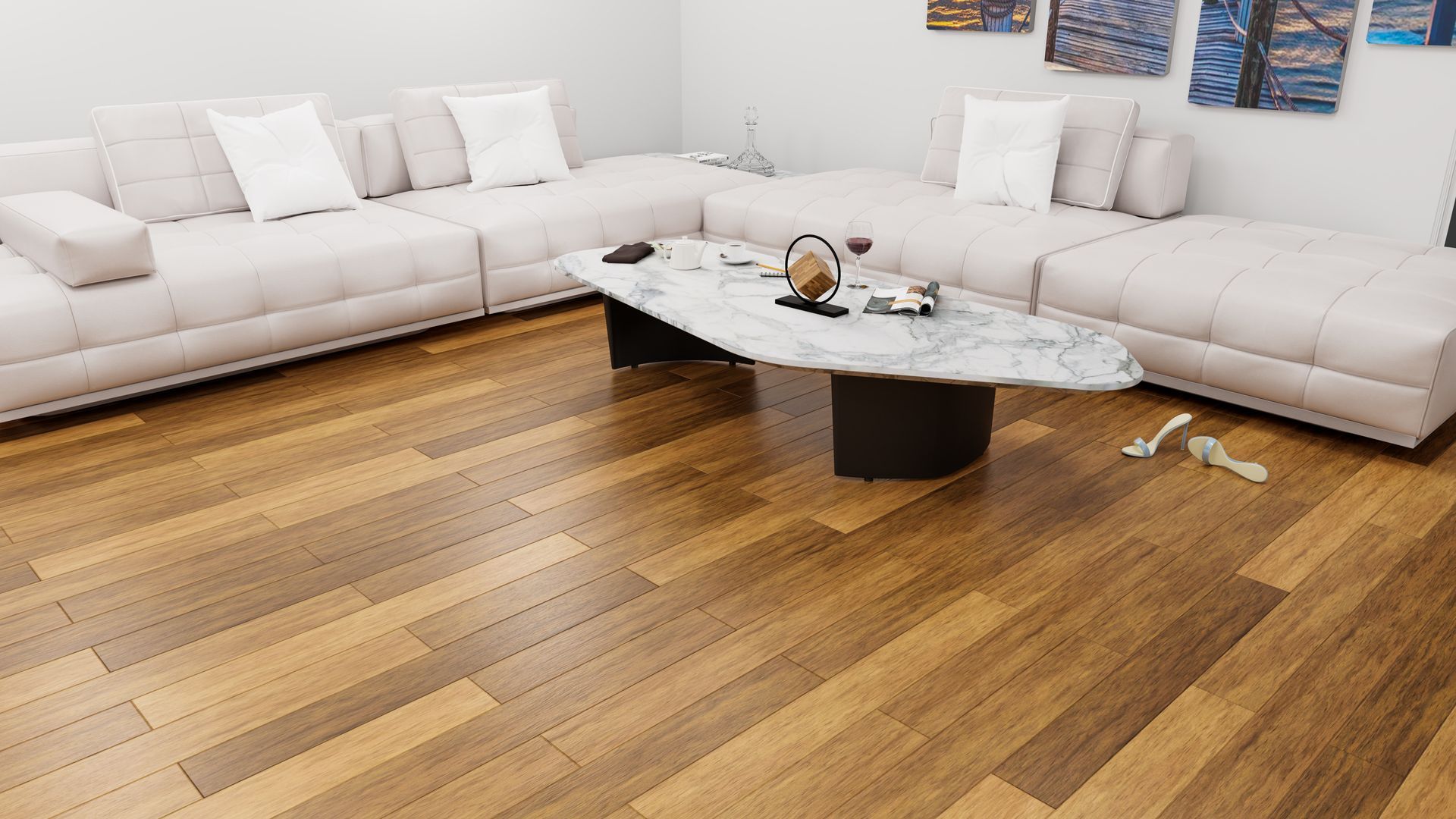 Bright living room with white sectional sofas, a marble coffee table, and hardwood floors Bright living room with white sectional sofas, a marble coffee table, and hardwood floors