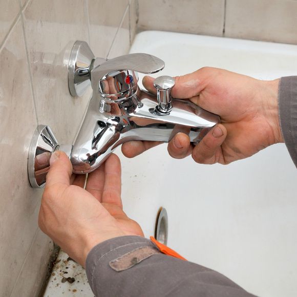 Plumber Installing Faucet — Fostoria, OH — Roto Rooter of Fostoria