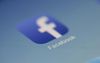Facebook app icon on a smartphone screen, blue and white, with the word 