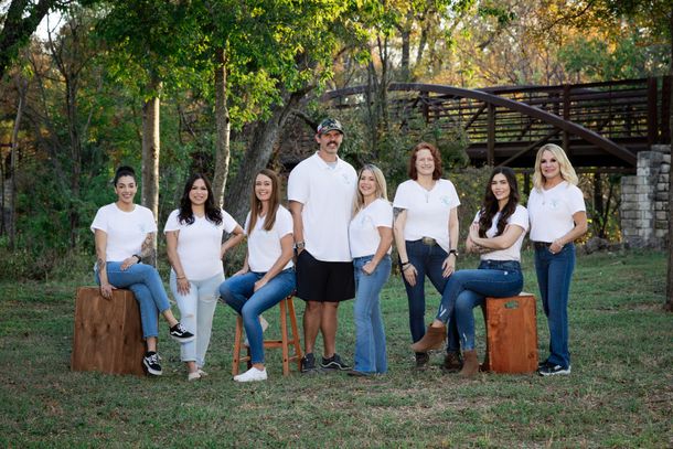 Green rubber plant with large, oval leaves against a white background.
