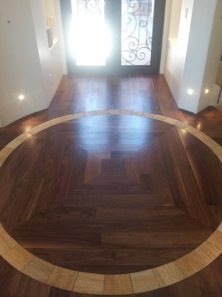 A wooden floor with a circle in the middle of it