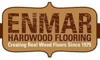 The logo for Enmar Hardwood Flooring creates real wood floors since 1975.