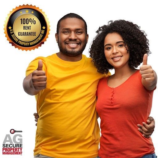 Smiling couple with thumbs up, promoting secure property management with a 100% rent guarantee.