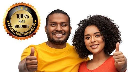 Smiling couple with thumbs up, next to a gold 