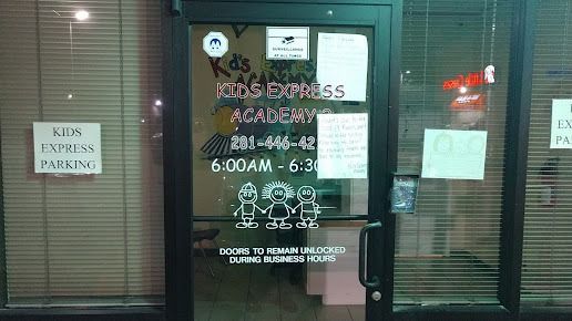 Kids Express Academy storefront. Glass door with business name, hours (6:00 AM - 6:30 PM), and a parking sign on the left.