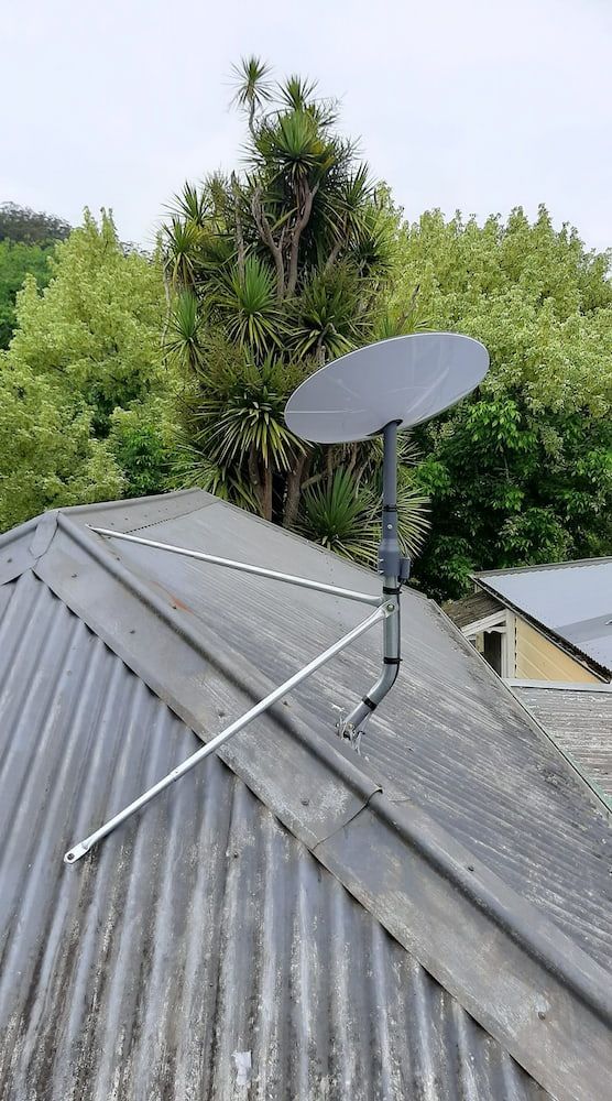 A Satellite Dish Is Sitting On Top Of A Roof — Boardman's TV Antennas in Basin View, NSW