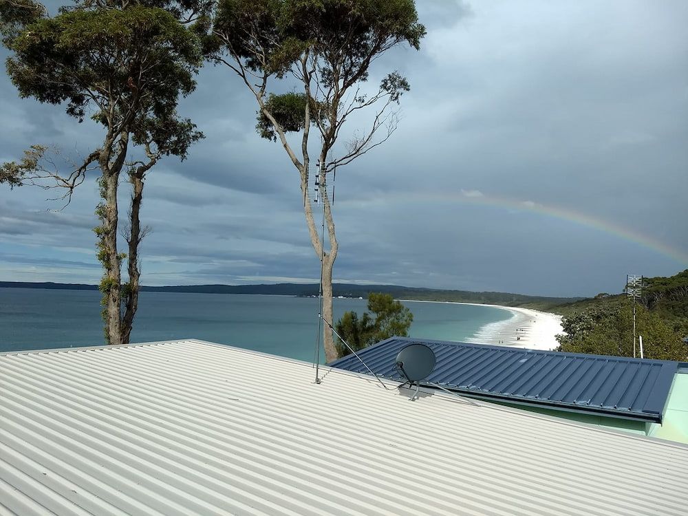 A Roof With A View Of The Ocean And A Rainbow In The Sky — Boardman's TV Antennas in Basin View, NSW