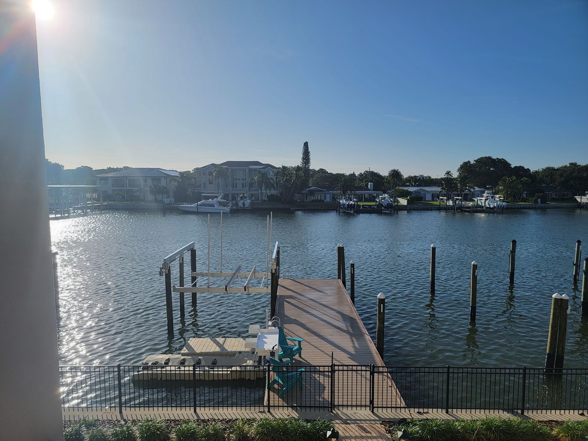 A large body of water with a dock in the middle of it