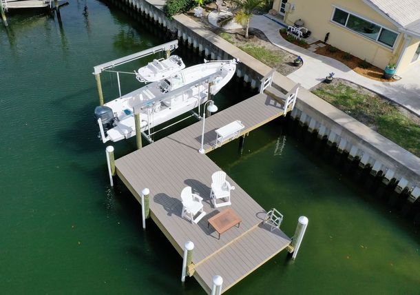 An aerial view of a dock with a boat on it