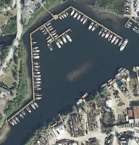 An aerial view of a marina with many boats docked