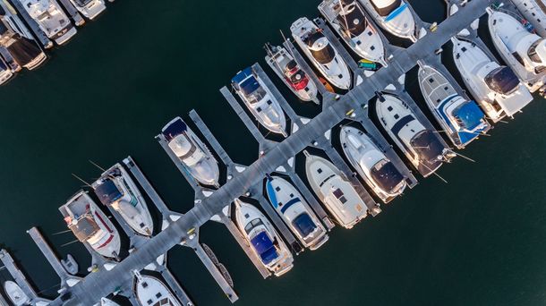 An aerial view of boats docked in a marina.