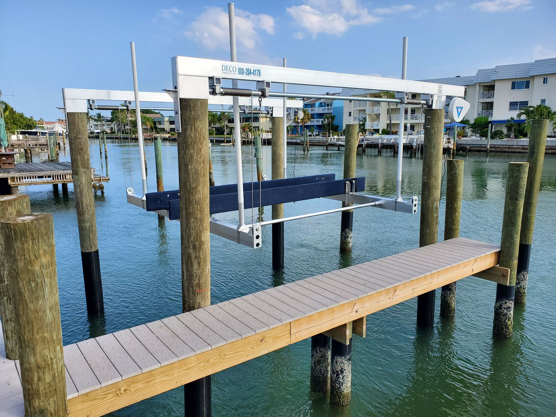 A dock with a boat lift attached to it