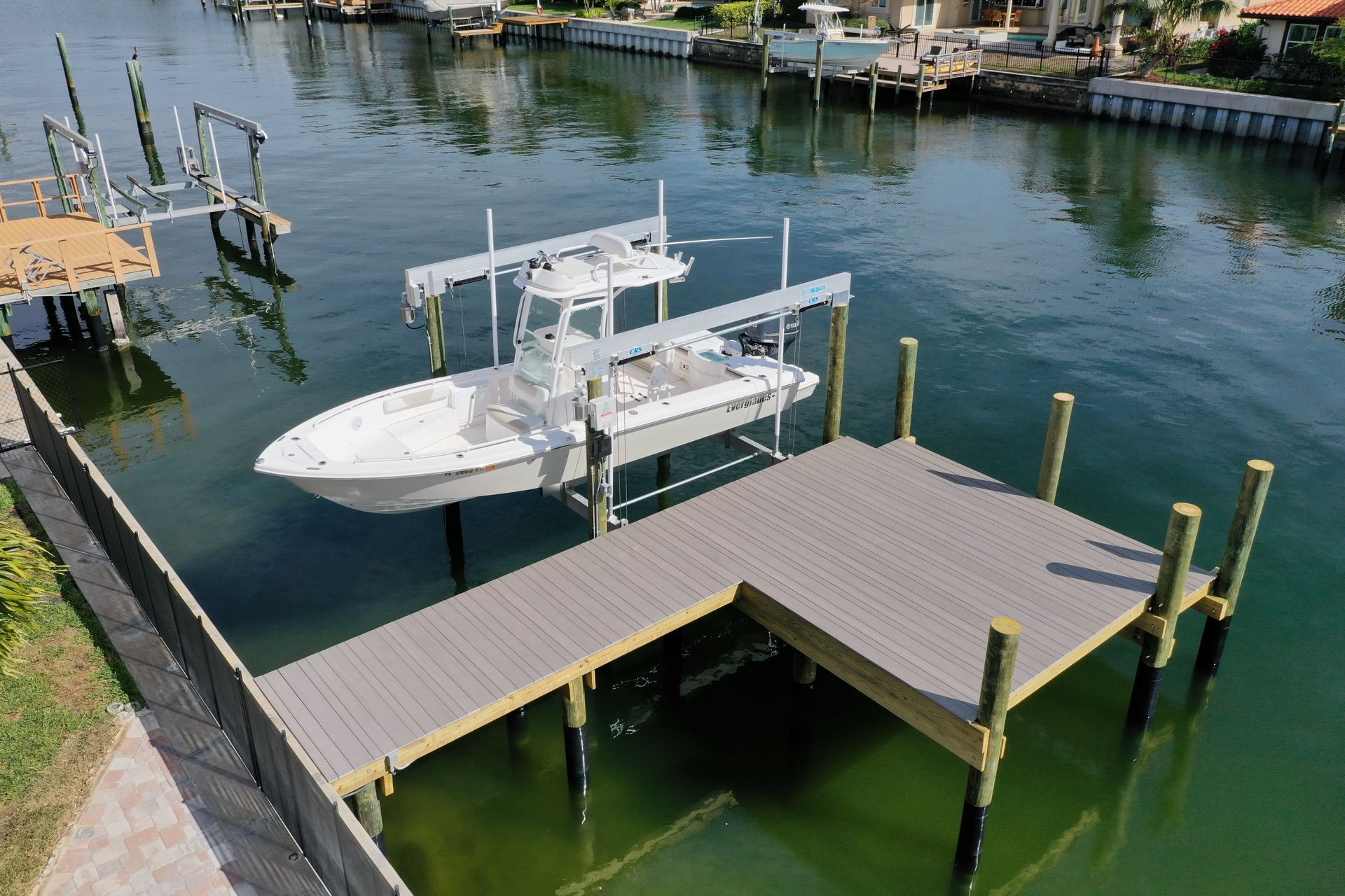 A boat is docked at a dock in the water.