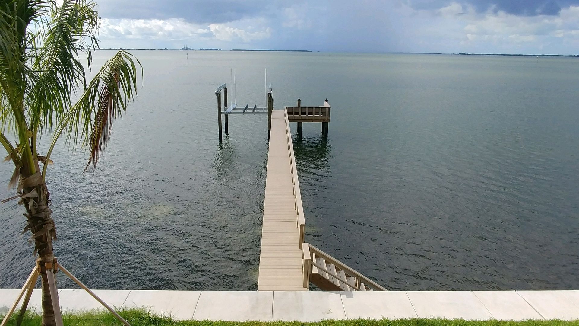 A dock in the middle of a body of water.