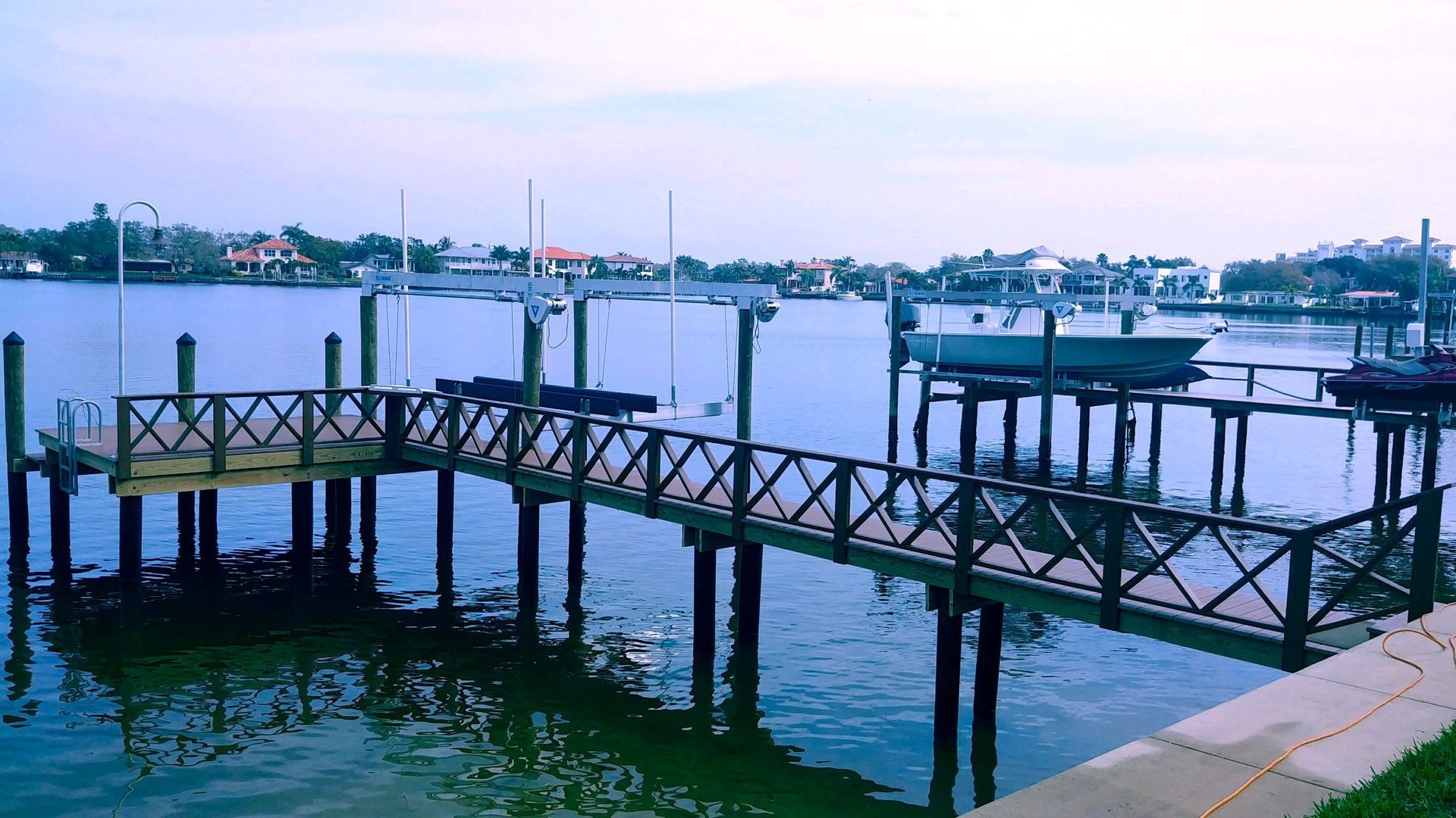 A boat is docked at a dock in the water