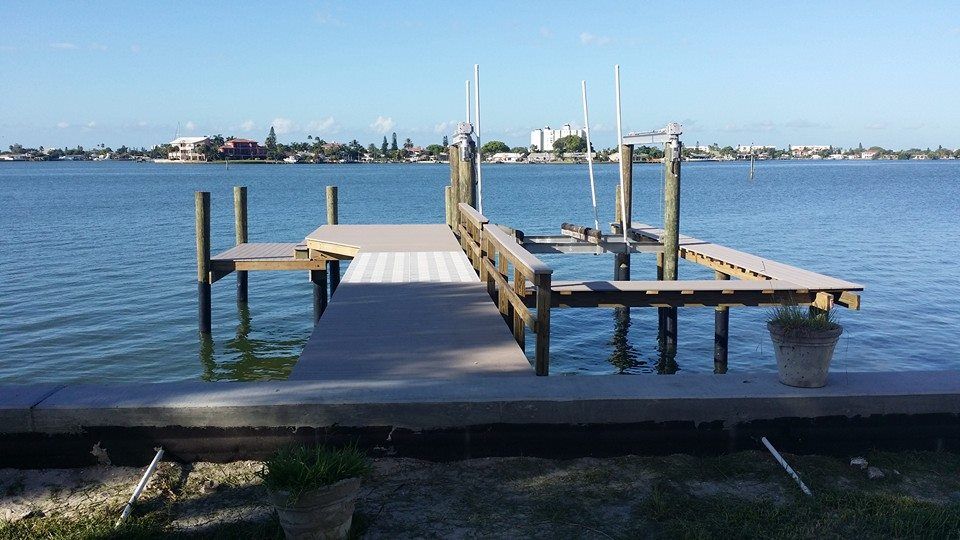 A large body of water with a dock in the foreground.