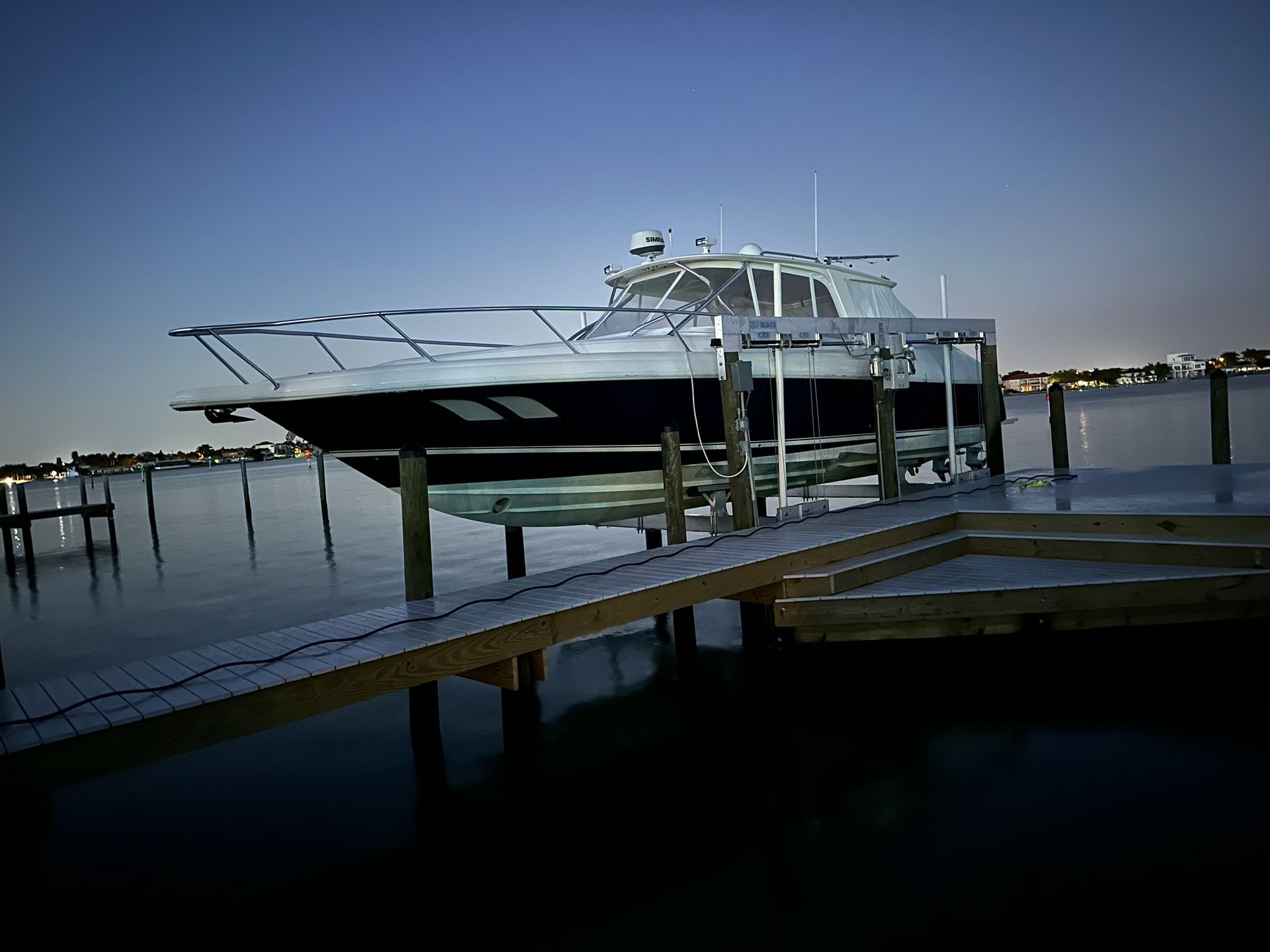 A boat is docked at a dock in the water.