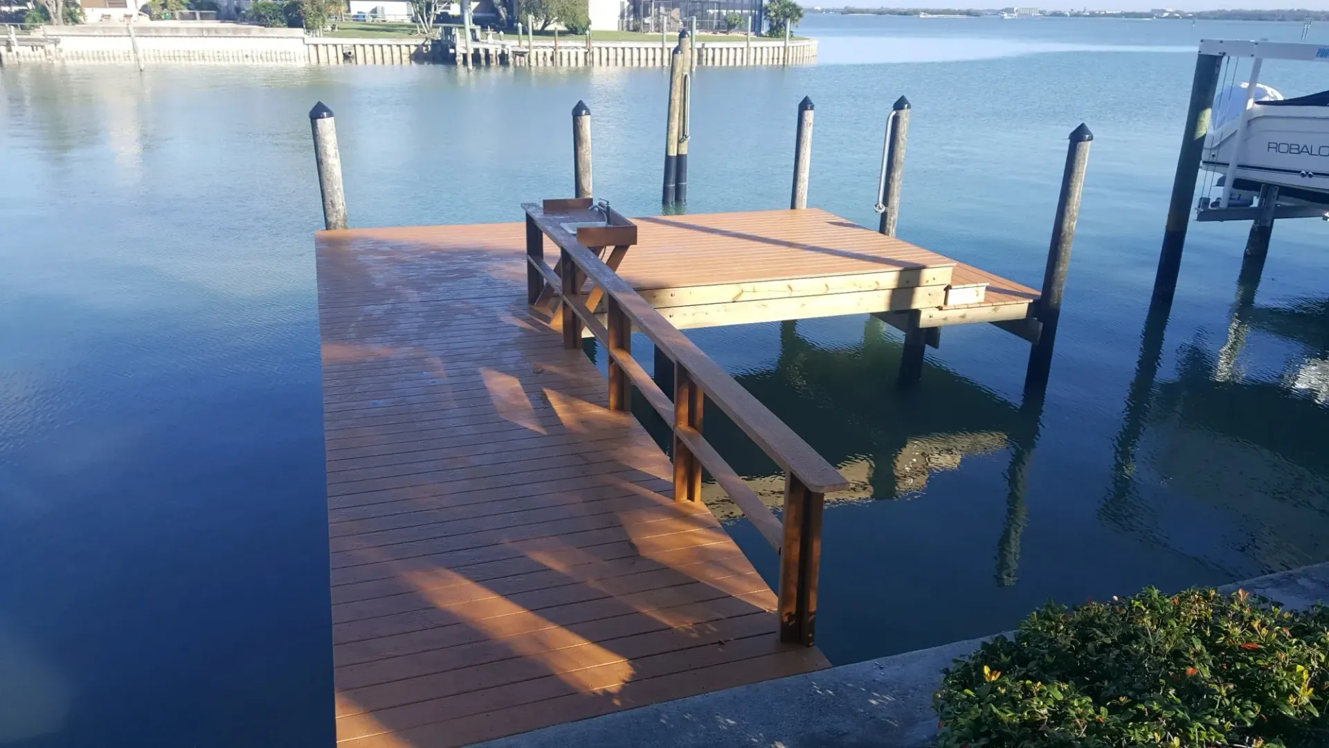 A wooden dock in the middle of a body of water