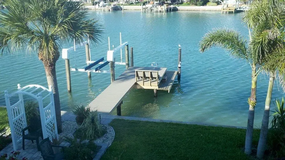 A large body of water with a dock in the middle of it.