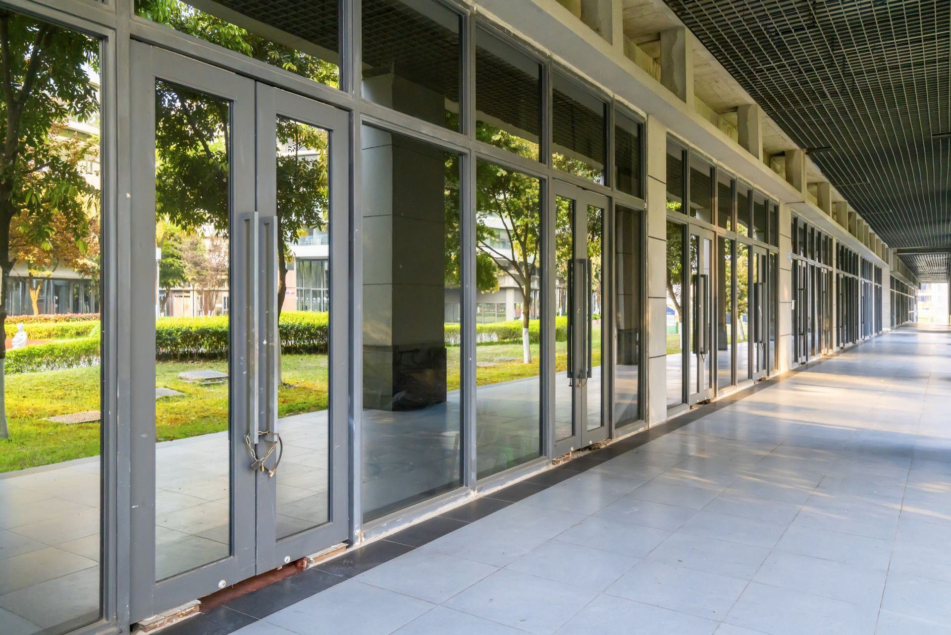 a long hallway with a lot of windows and doors in a building