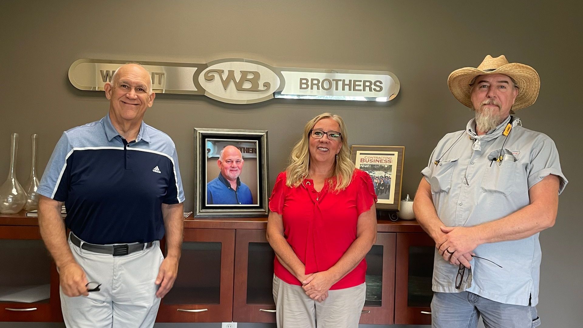 A group of men are posing for a picture together