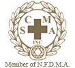 Emblem: CM/SA Inc. within cross, surrounded by wreath,