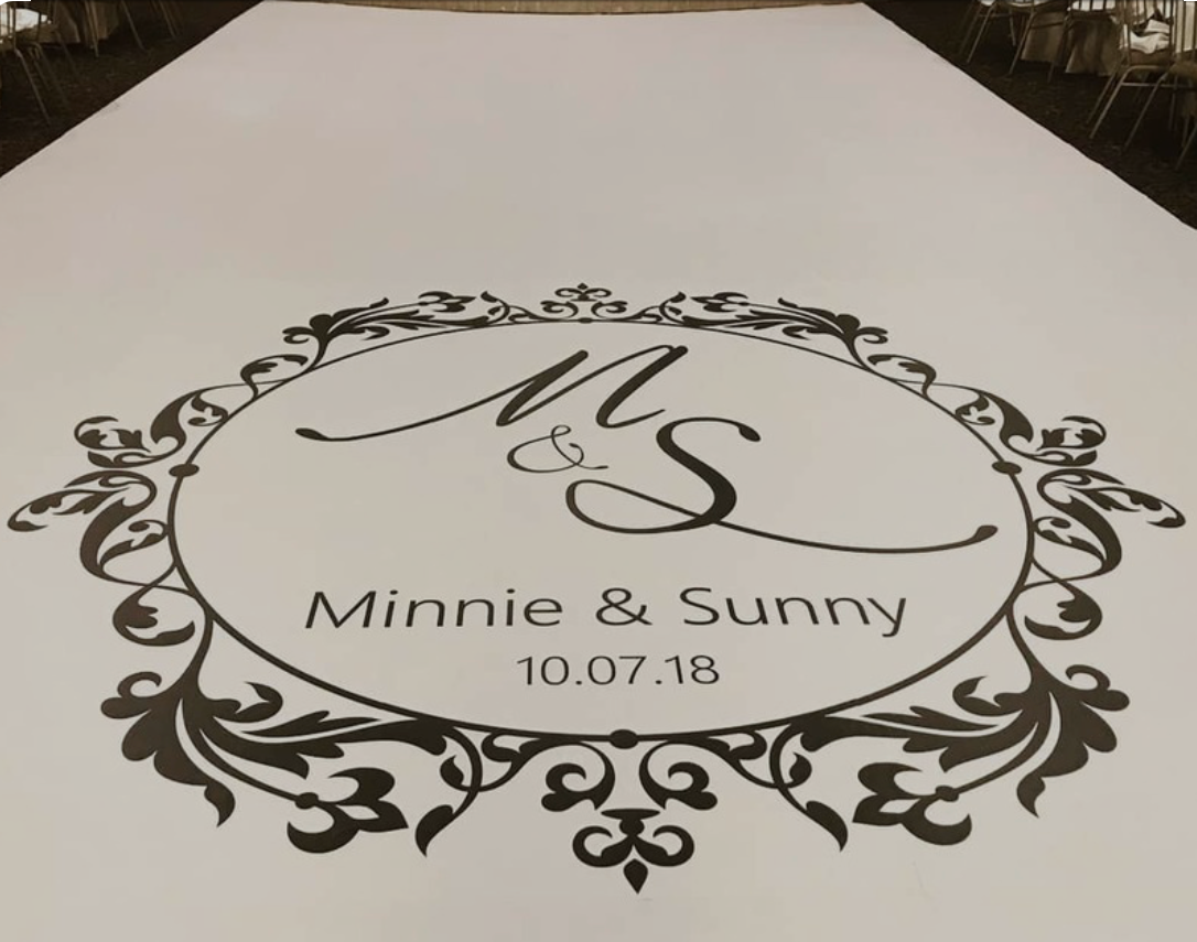 Minnie and sunny 's wedding logo on a dance floor