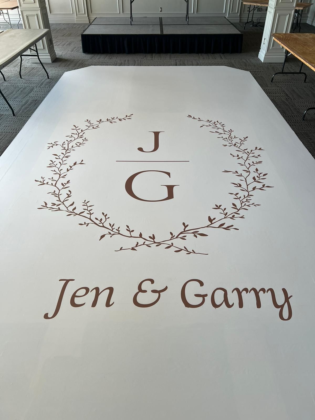 A white dance floor with the names jen and garry on it