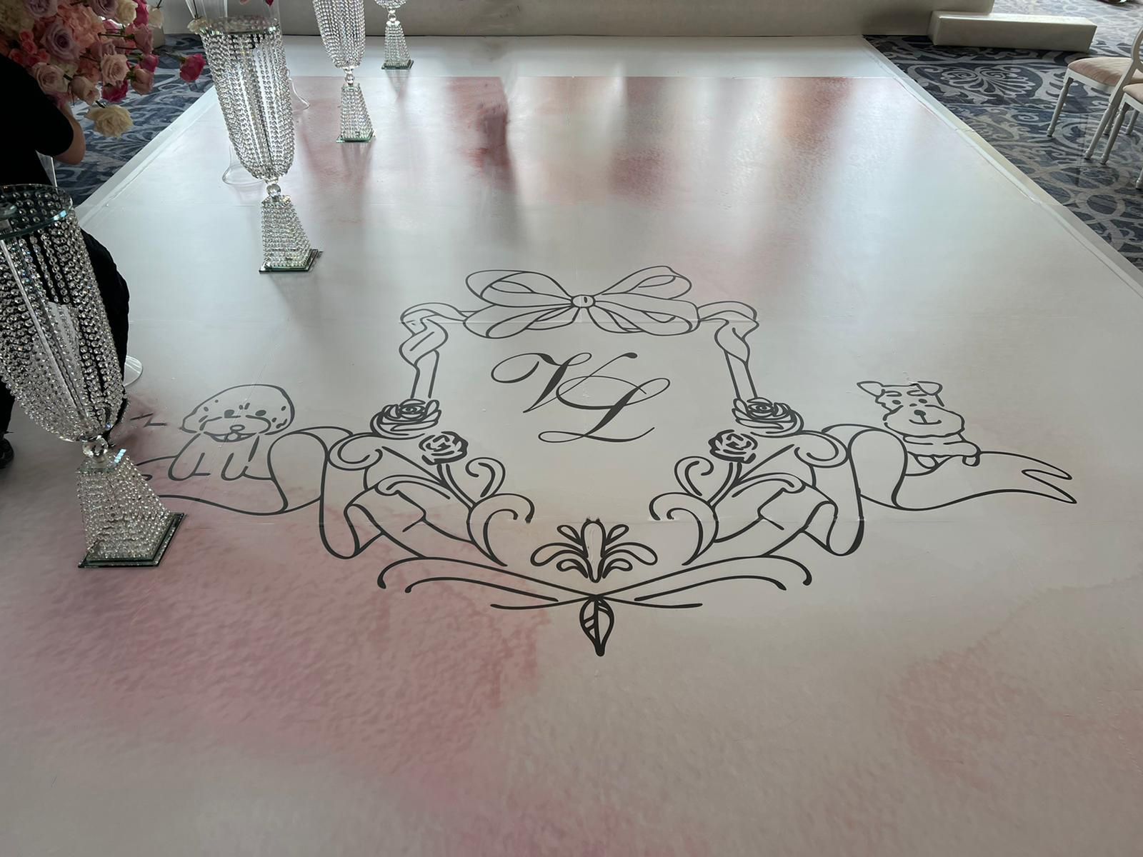 A wedding aisle with a monogram on it