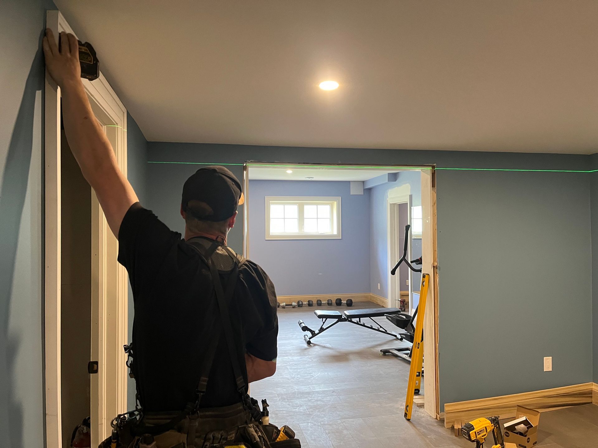 a man painting a ceiling