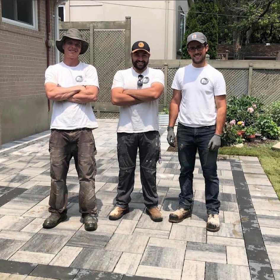 smiling workers on a renovated landscape flooring