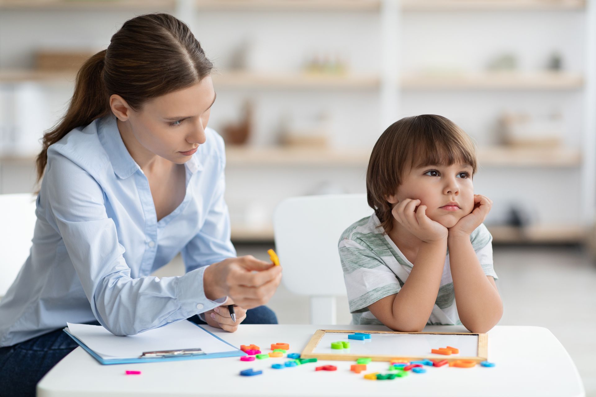 A boy and a girl are screaming at each other while watching tv