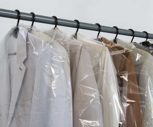 Rack with clean coats after dry cleaning on a dry cleaner