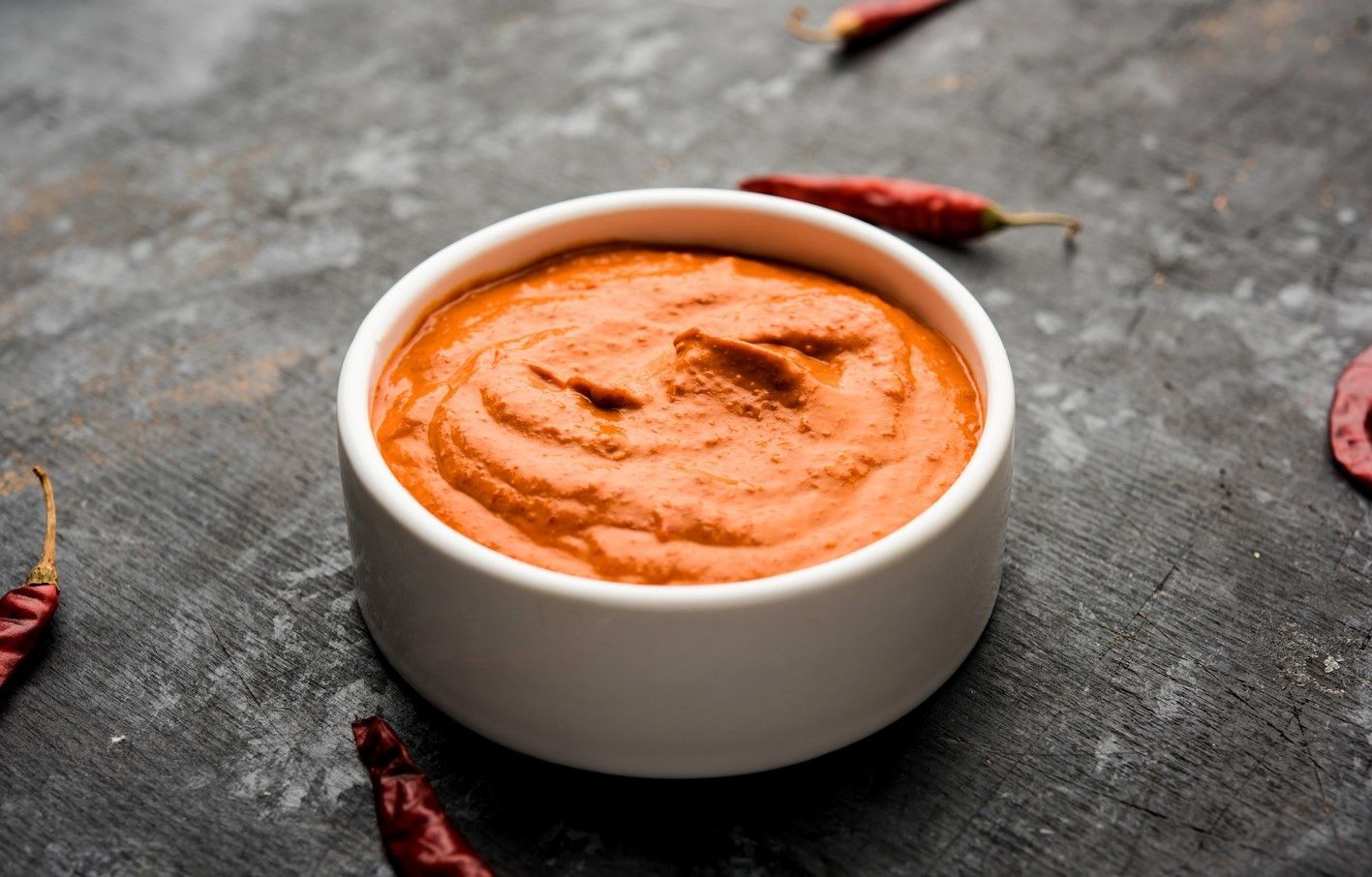 The history of Peri-Peri is a controversial one, it is believed that it was created by Portuguese explorers in Mozambique in the 15th century who discovered the African bird’s eye chilli pepper and made a marinade with garlic, red wine vinegar, paprika, and other European ingredients.