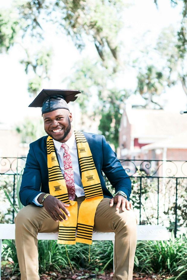 Prestige Scholar graduates in black gowns and mortarboards walking outdoors, smiling
