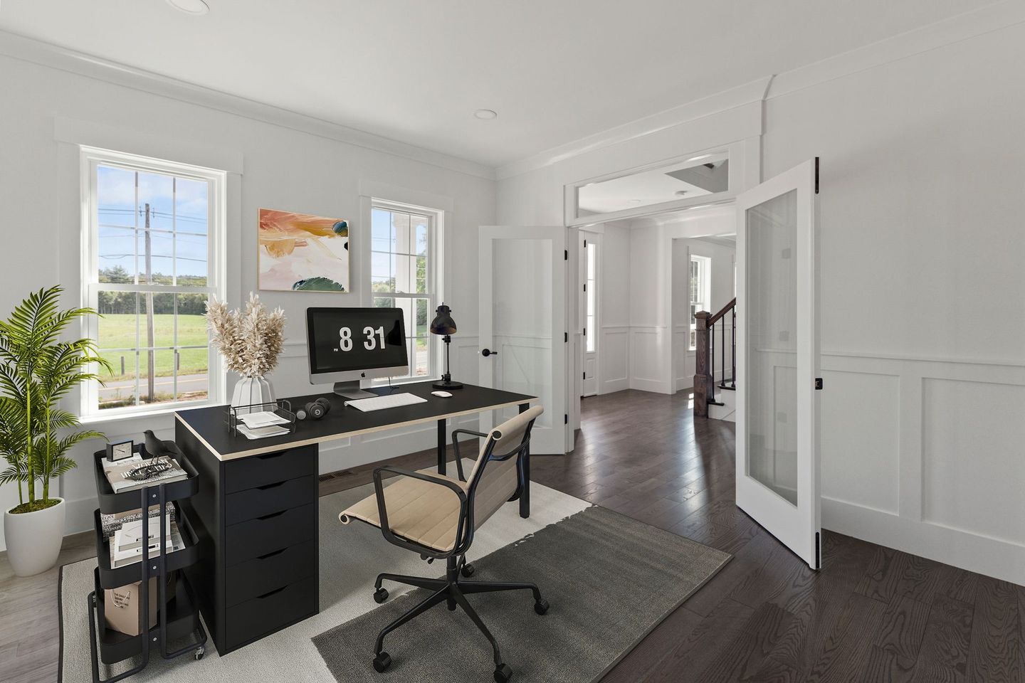 A home office with a desk , chair and computer.