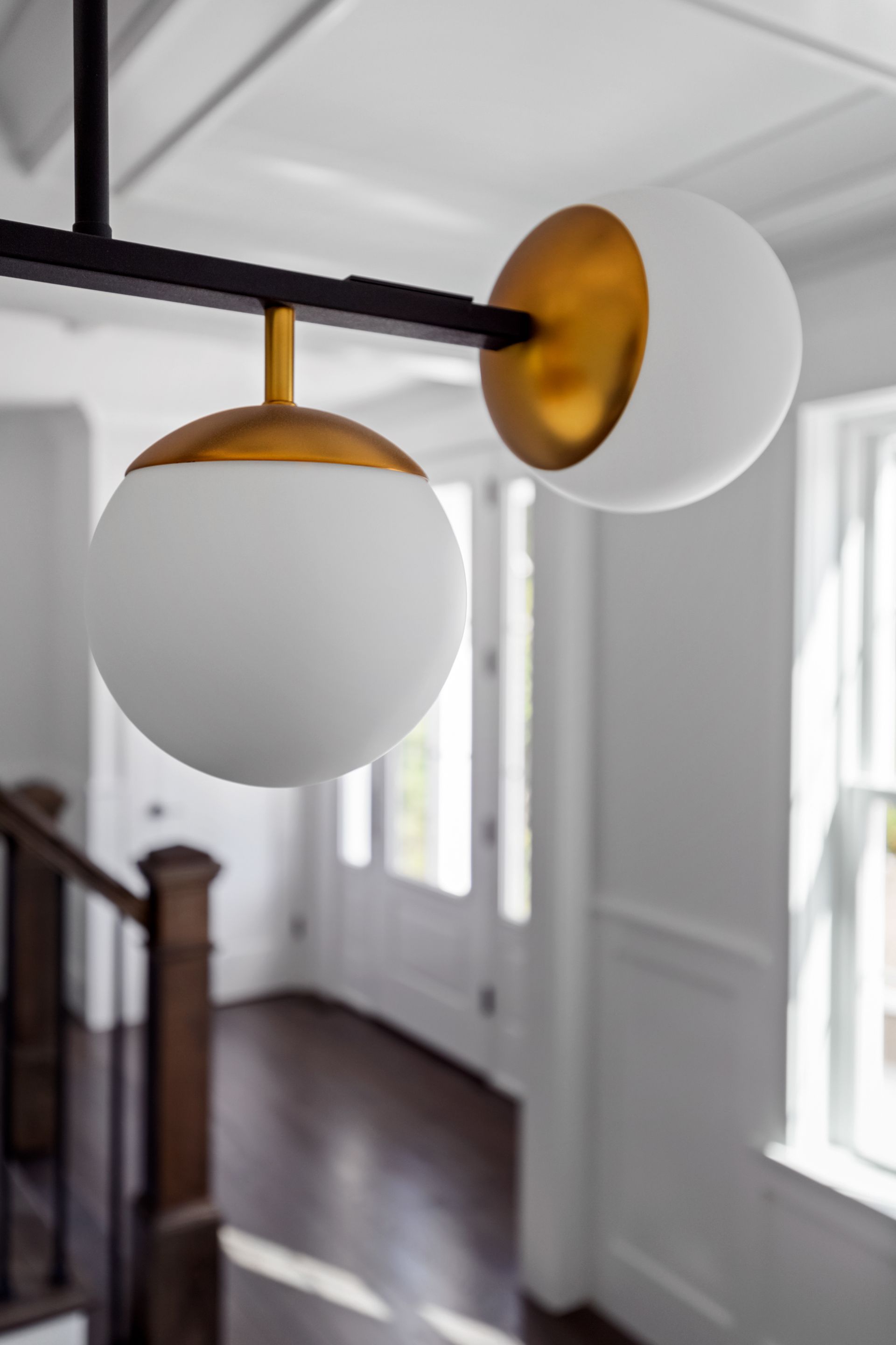 A staircase with a light hanging from the ceiling