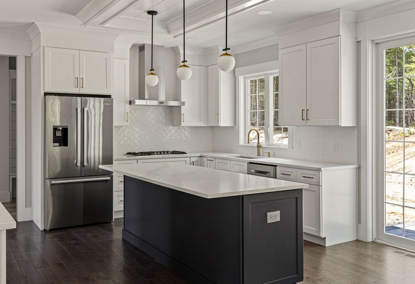 There is a large island in the middle of the kitchen.