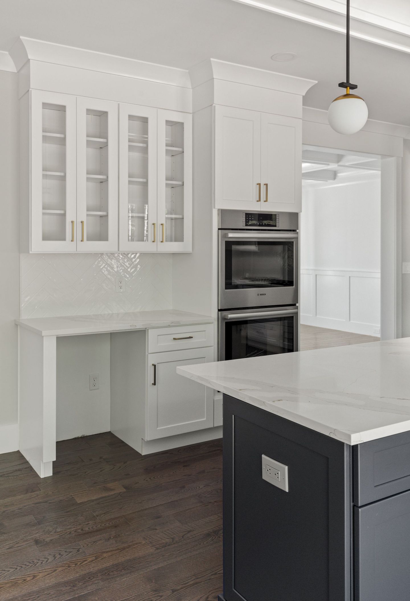 There is a large island in the middle of the kitchen.