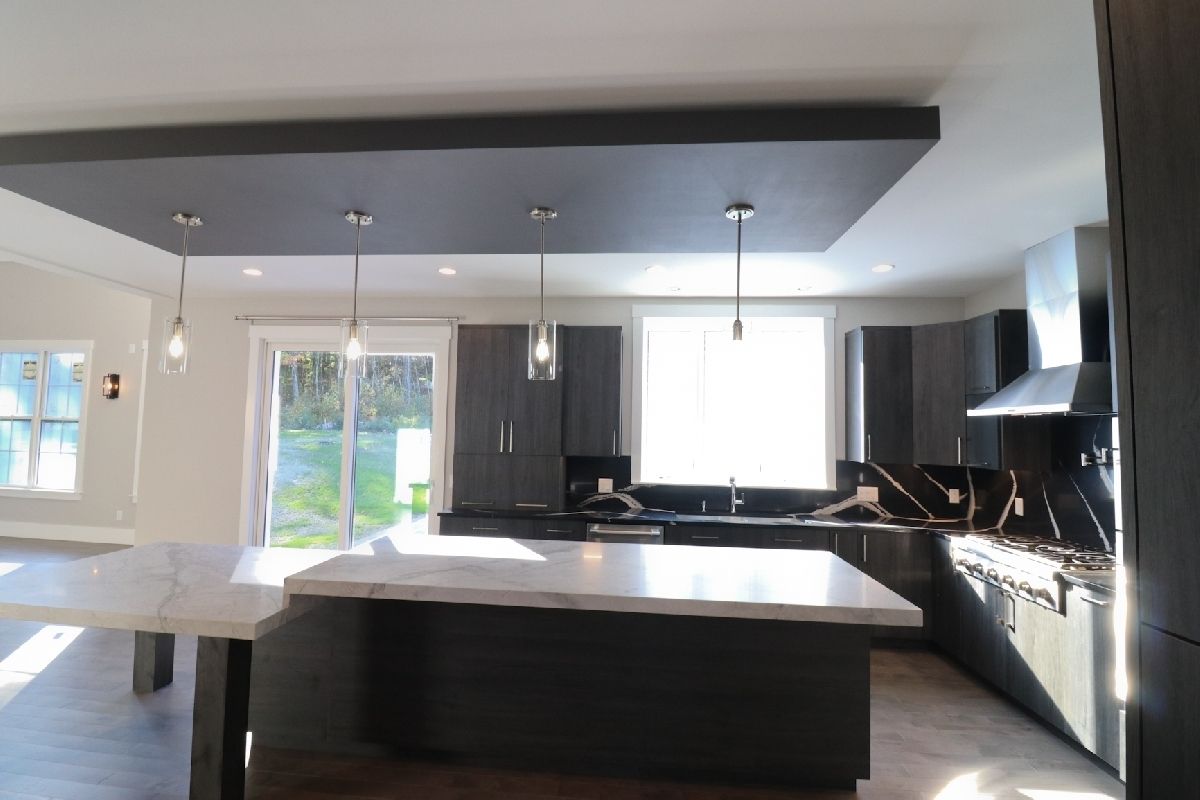 A kitchen with a large island in the middle of it