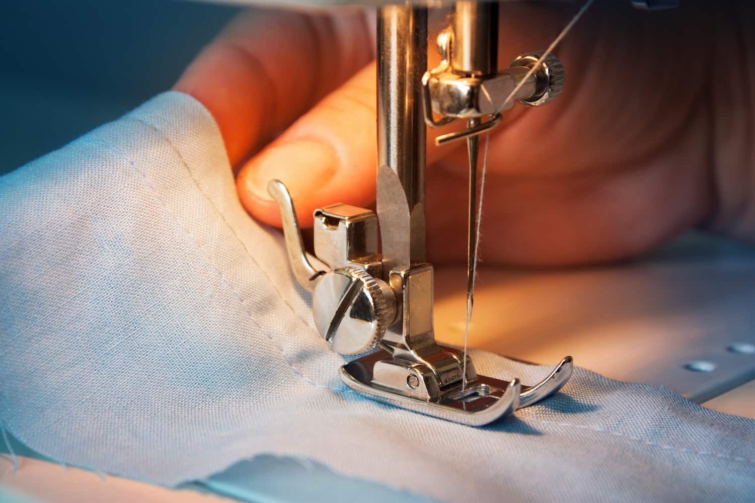 A Person Is Using A Sewing Machine To Sew A Piece Of Fabric — Bernina Sewing Centre In Mackay, QLD