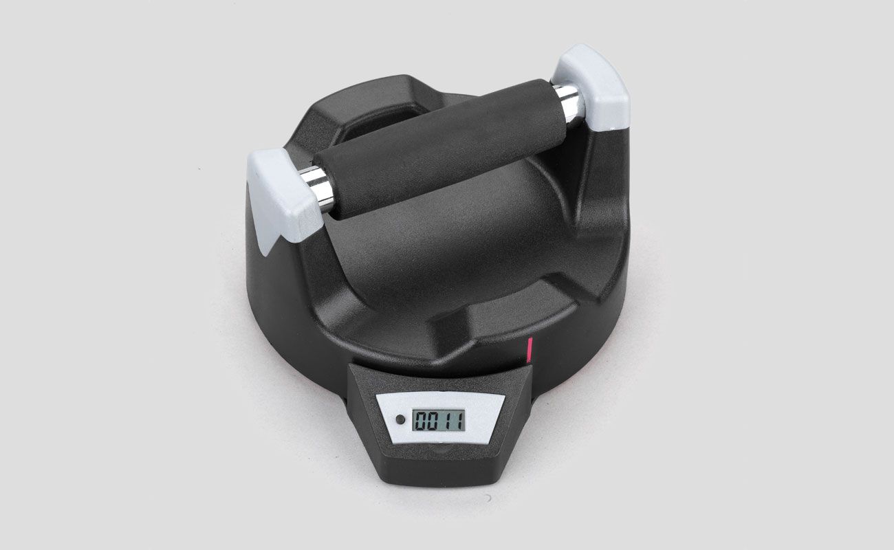 A black and white dumbbell with a digital display on it
