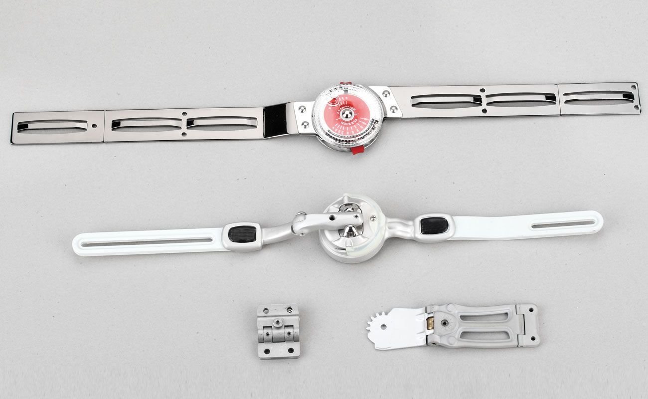 Two pieces of metal are sitting next to each other on a table.