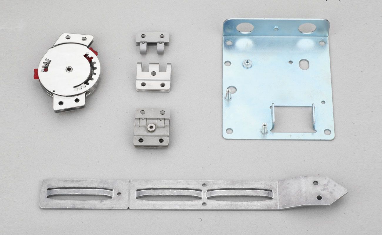 A bunch of metal parts are laying on a table