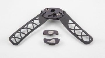 A close up of a black object on a white surface.